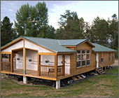 A manufactured log home during construction