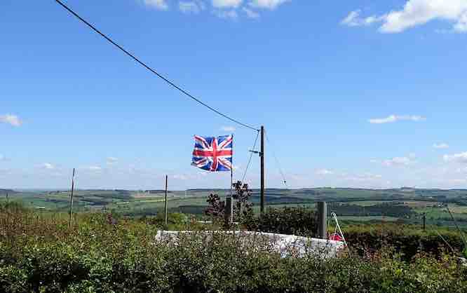 Union jack under power line | Off-Grid living UK | Living Off the Grid: Free Yourself | earthships, prepper, self-sufficient, camping, wind power, renewable energy, permaculture, self-build, post-covid