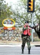 After a power outage on the base, Spc. Elizabeth Gruden from the 18th Military Police Detachment on Fort Huachuca directs traffic at the intersection of Buffalo Soldier Trail and Fry Boulevard on Saturday morning. Power was knocked out in that area of the city for about 45 minutes.