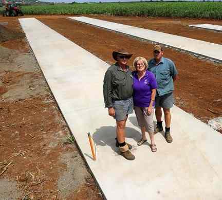 Kelvin Griffin stadning in his field on the concrete pads that will house his new solar array