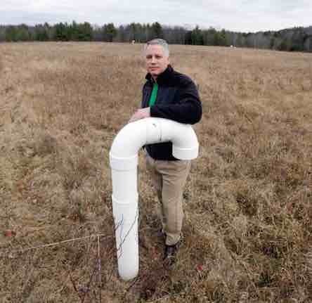 Nassau Township Supervisor David Fleming with pipe for Community microgrid plans